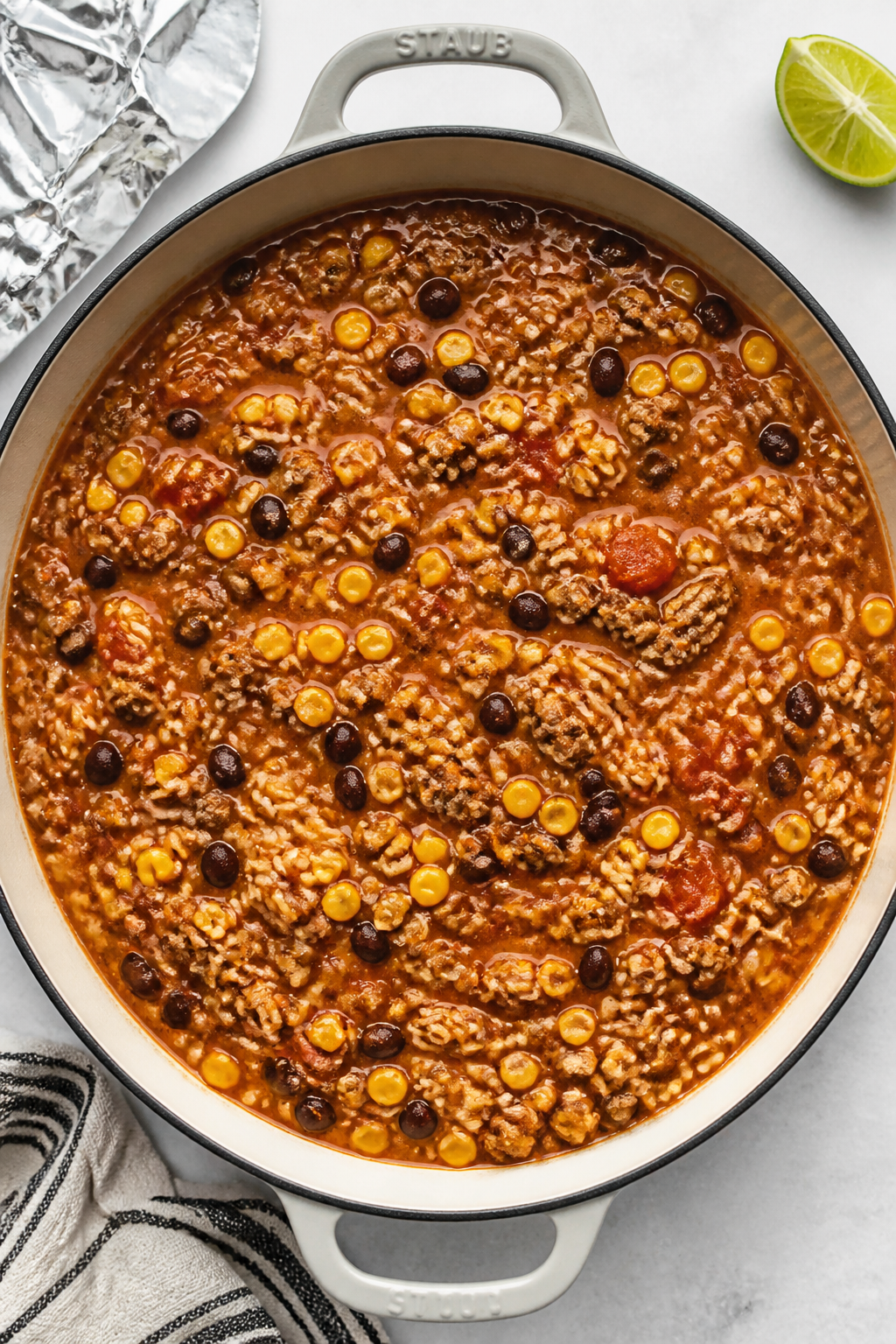 Cooking process: Overhead shot of the casserole mixture simmering in an oven-safe skillet right befo
