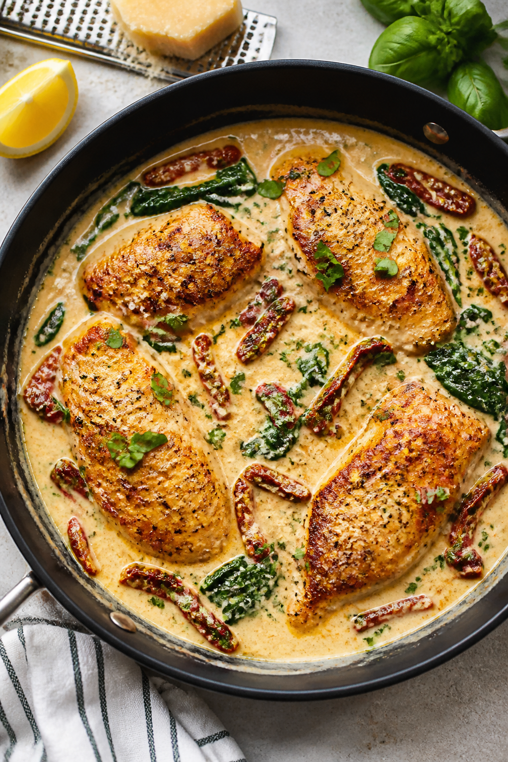 Creamy sauce moment, overhead tasty top view: The Healthy Marry Me Chicken simmering in a light, vel