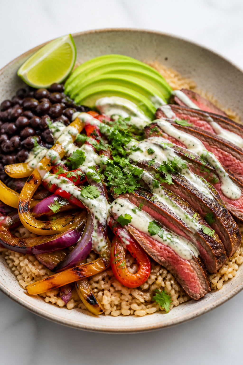 Final plated bowl beauty: High Protein Steak Fajita Bowl artfully arranged in a wide, shallow cerami