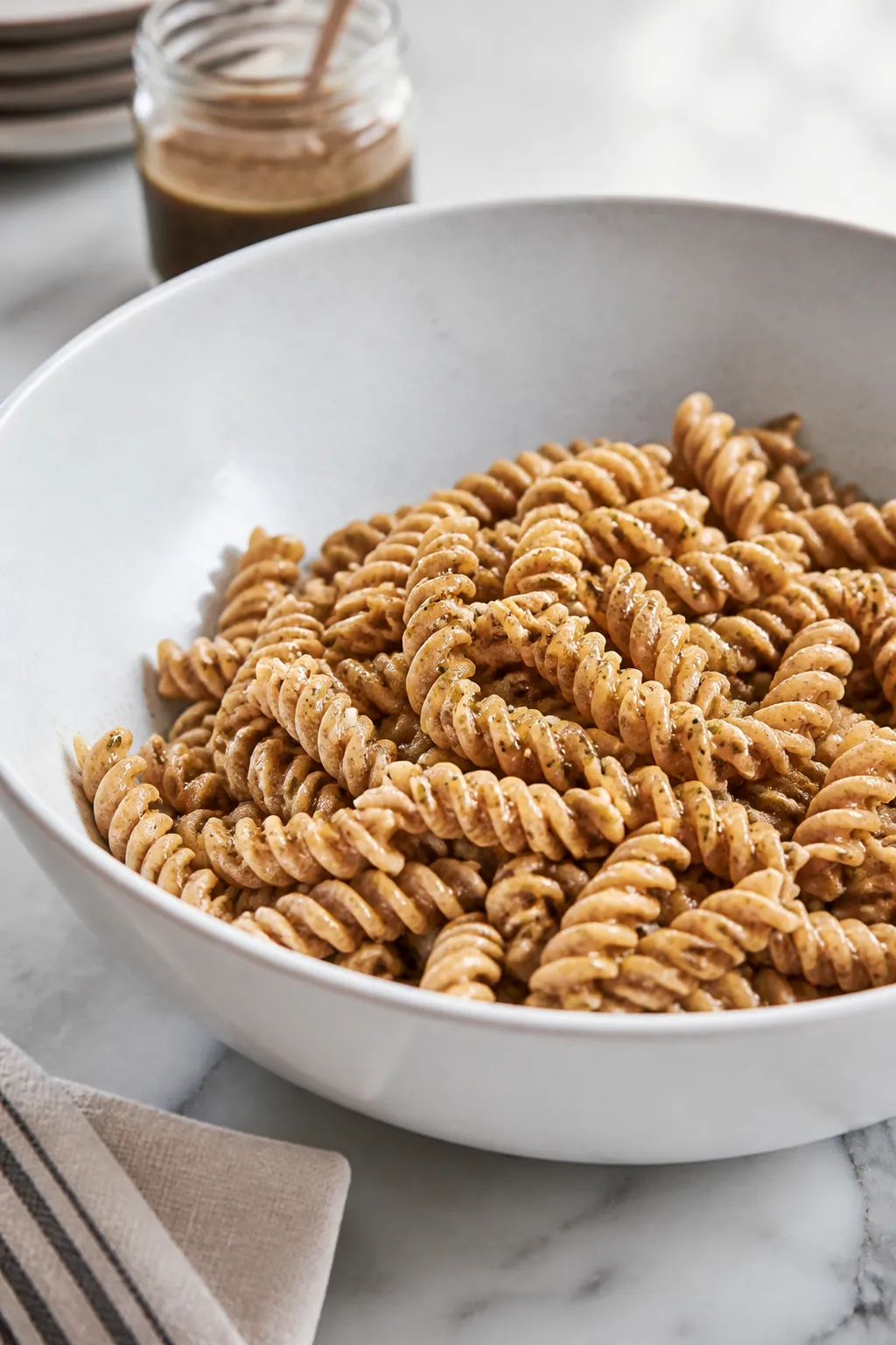 Cooking process: Al dente whole-wheat rotini just drained and briefly rinsed in a colander, steaming
