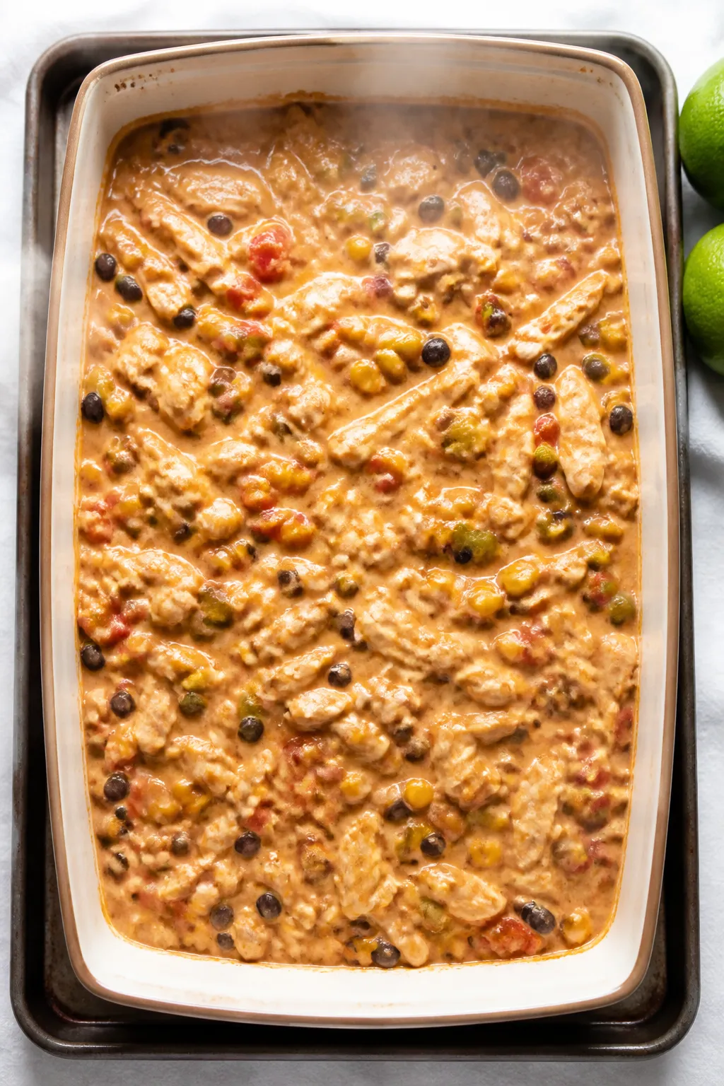 Cooking process shot: The casserole mid-bake right after stirring in step 7âcreamy sauce coating t