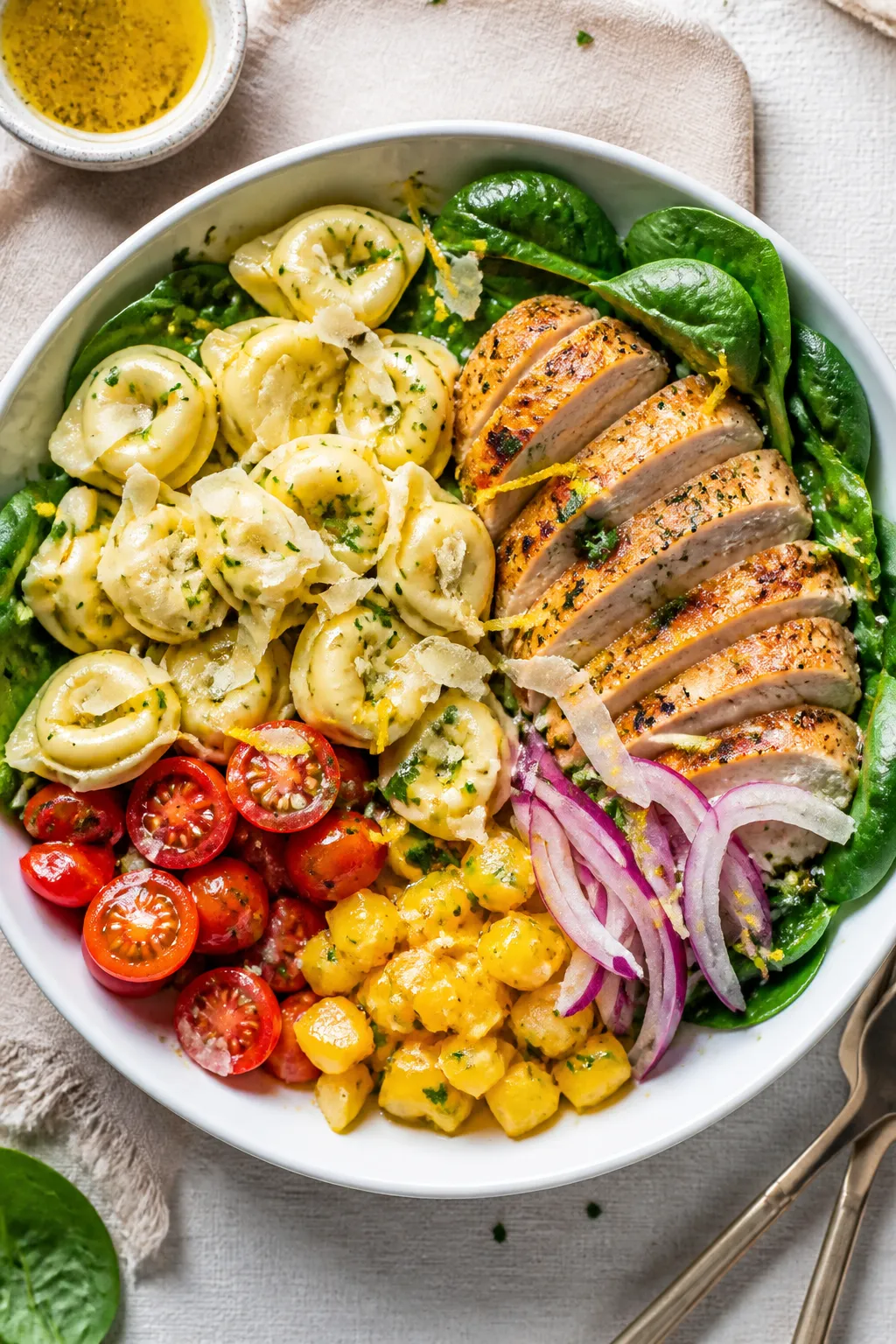 Final dish presentation: Beautifully plated Chicken Tortellini Meal Prep Bowl arranged in a shallow 