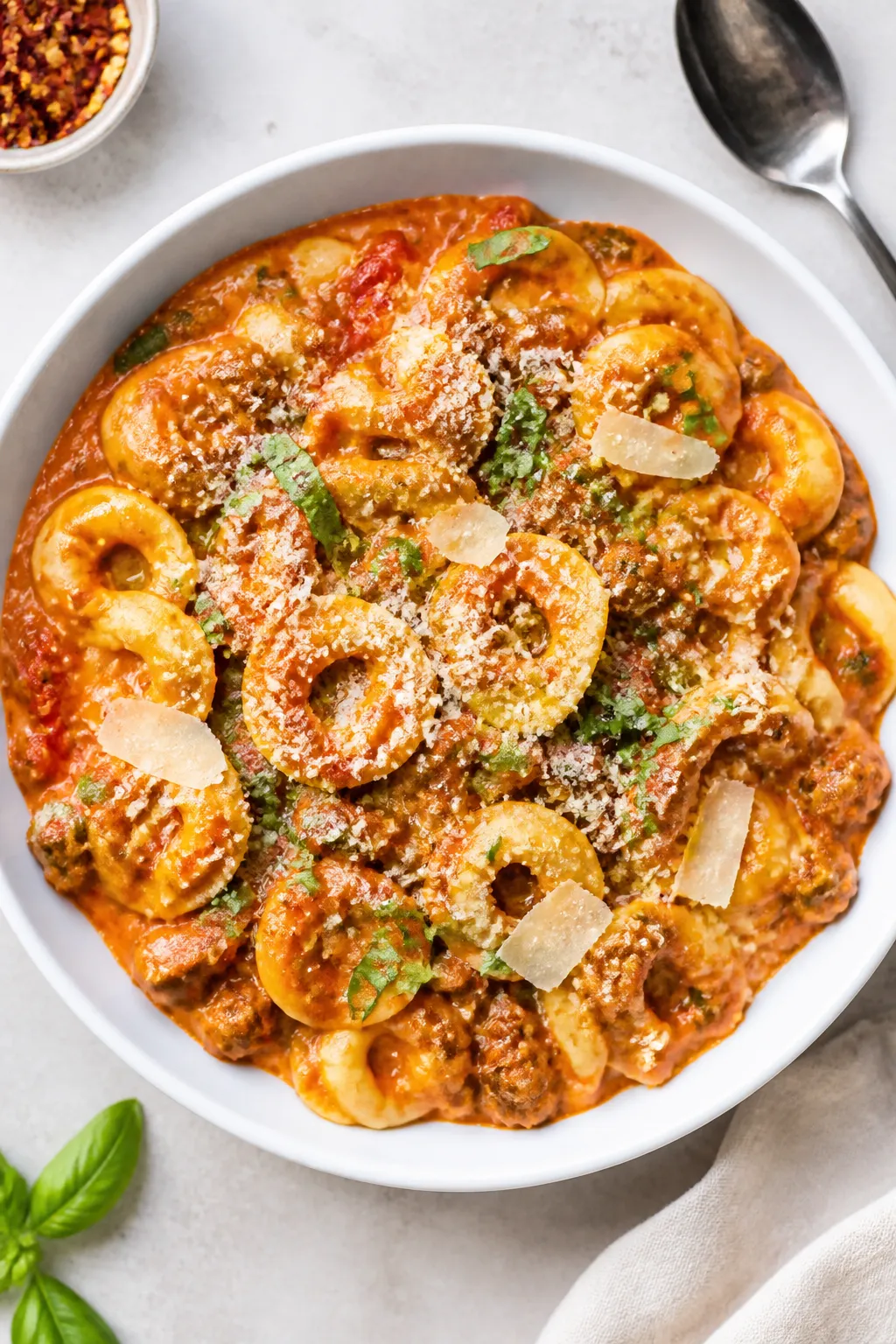 Final plated hero, top-down: Restaurant-quality bowl of One Pot Beef Tortellini Pasta, overhead shot