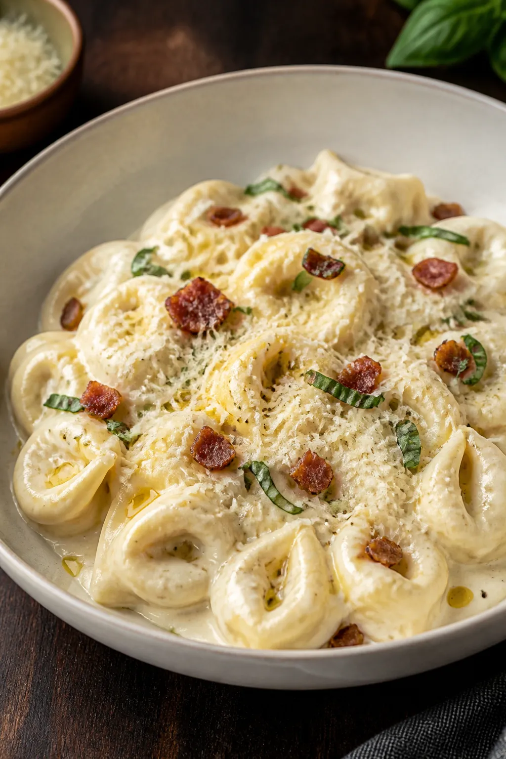 Final plated presentation: Restaurant-quality bowl of Creamy Parmesan Tortellini with a luxurious, s