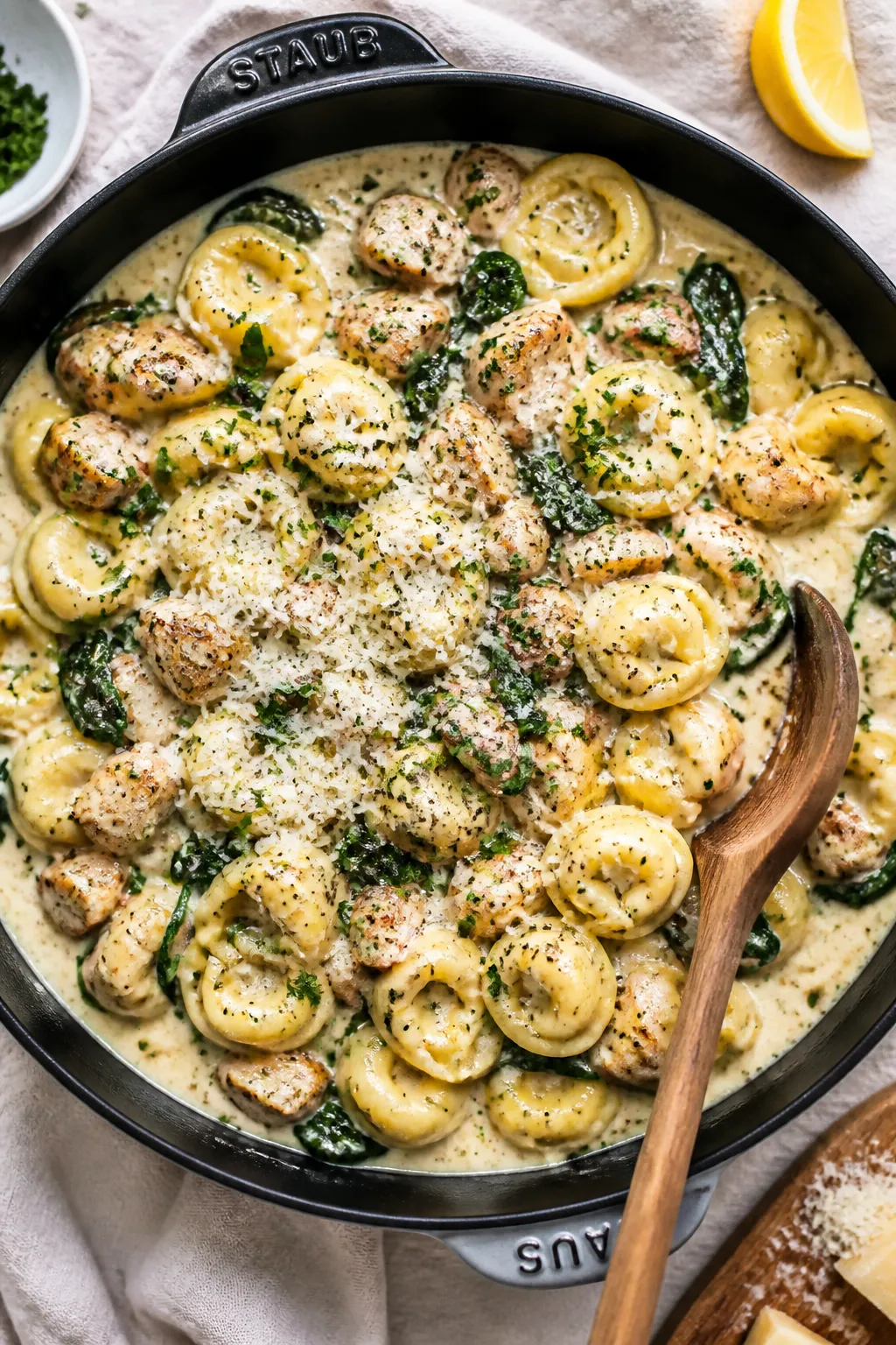 Tasty top view: Overhead shot of the finished Creamy Chicken Spinach Tortellini Skillet, tortellini